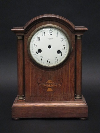An Edwardian inlaid oak arch shaped clock case with enamelled  dial - no movement 9"