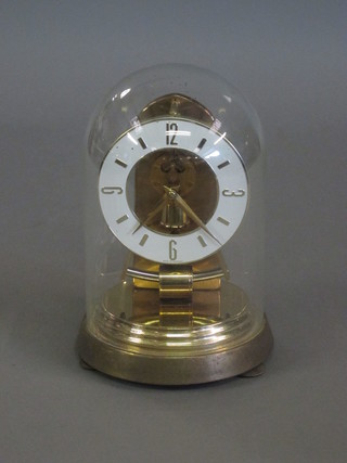 A West German battery operated 400 day clock complete with  dome