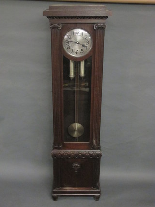 A striking longcase clock with circular silvered dial and Arabic numerals contained in an oak case 81"