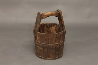 An Oriental wooden bucket