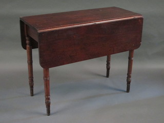 A 19th Century drop flap Pembroke table raised on turned  supports 36"
