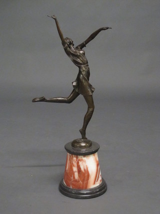 A bronze Art Deco figure of a dancing girl raised on a shaped  marble base 27"