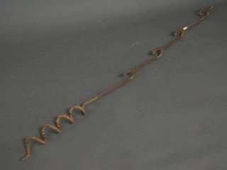 An iron military barb wire support 66"