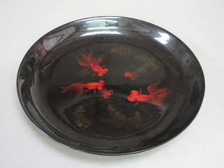 A circular Eastern lacquered bowl decorated Carp 16"