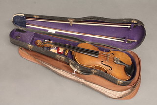 A violin with 2 piece back labelled Johann Bader Muncher 1928  14", complete with case and 2 bows