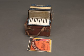 An Estrella accordion with 12 buttons, cased