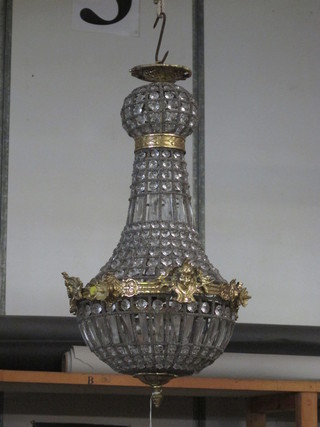 A handsome gilt metal and glass circular light fitting