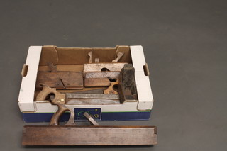A large wooden jack plane, a smoothing plane and 4 planes and  4 tenon saws