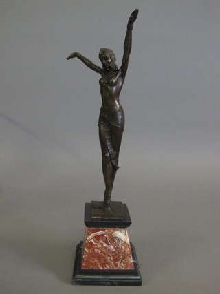A bronze Art Deco style figure of a standing lady, raised on a waisted base 20"