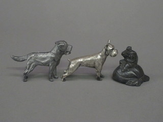 An Oriental metal figure of a seated Chinaman 3" and 2 figures  of dogs