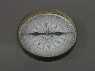 A compass contained in a gilt metal case 3"   ILLUSTRATED