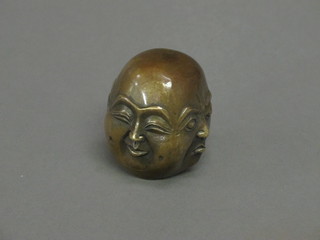 A bronze figure of a multi faced Buddha 2 1/2"