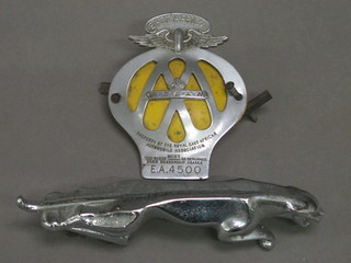A Jaguar car mascot and a Royal East Africa Automobile  Association car badge