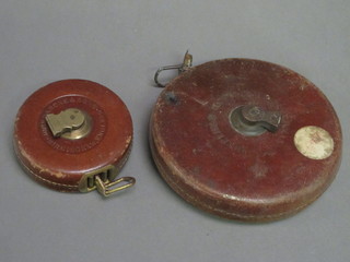 A Chesterman 100' War Office Issue tape measure and a John Rabone 35' tape measure