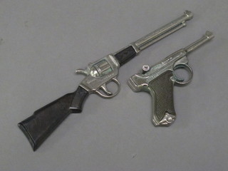 A Redando cap gun in the form of a Luger and 1 other in the  form of a rifle