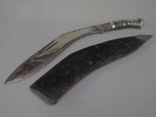 A Kukri the engraved blade marked Made in India 16" with  leather carrying case, no skinning knives