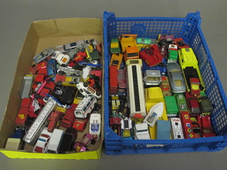 A blue crate containing various cars and a cardboard crate containing model cars