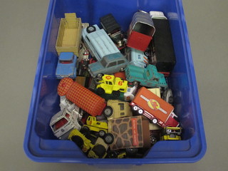 A blue crate containing Dinky and Corgi cars