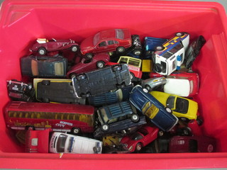 A collection of toy cars in a plastic crate