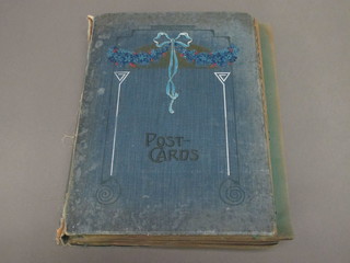 A blue album containing postcards