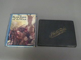 An album of black and white postcard photographs and 1 volume "The Blue Book of War"