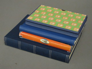 A large blue stock book of stamps, a Luxury Standard stamp  album, an Adelphi blue stamp album and a black stock book of  stamps
