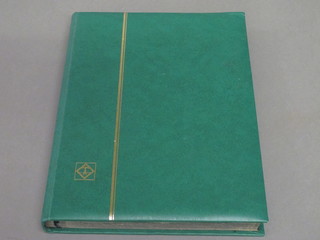 A green stock book of Olympic stamps
