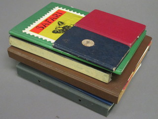 A small brown stock book, a black stock book, a Safari stamp album, a green loose leaf stamp album, do. blue, do. brown and  black