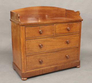 A Victorian mahogany chest with three-quarter gallery fitted 2  long and 2 short drawers with tore handles, raised on bun feet  42"