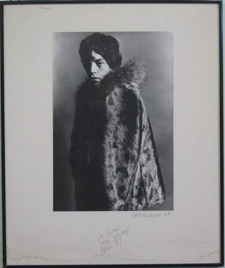 A signed black and white photograph of Mick Jagger