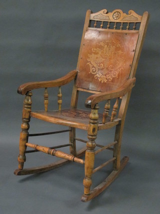 An Edwardian bleached wooden rocking chair