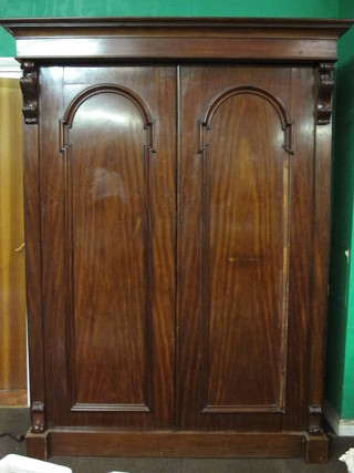 A 19th Century mahogany wardrobe with moulded cornice, the  interior with hanging space and 4 drawers above 1 long drawer,  62"