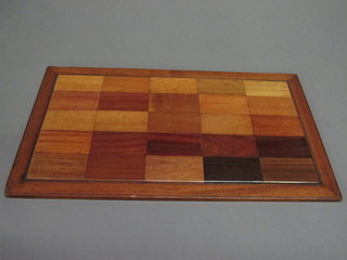 A rectangular tray containing samples of various woods 19" x  12"