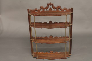 A 19th Century Continental mahogany and brass 4 tier hanging shelf 26"