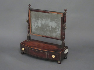 A 19th Century rectangular plate dressing table mirror contained  in a mahogany swing frame, the bow front base fitted 1 long and  2 short drawers, raised on bun feet 18"