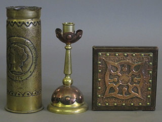 A WWI Trench Art shell case decorated a figure of Liberty  marked 1914 together with an Art Nouveau style copper and brass candlestick 7" and a do. teapot stand