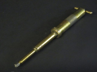 An Enats brass grease gun