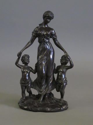 A bronzed figure of a standing mother and 2 children 13"