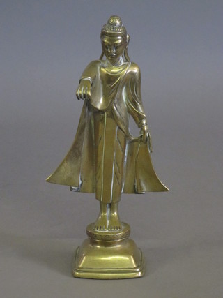 A gilt metal figure of a standing Eastern Deity 11"