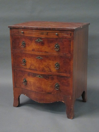 A Georgian style walnut chest of serpentine outline fitted a brushing slide above 3 long drawers, raised on bracket feet 24"