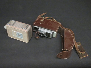 A Brownie cine camera together with a Bell & Howe cine camera