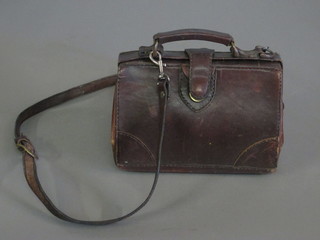 A lady's leather bag by Bosboom containing a reproduction  porcelain figure of a light dragoon
