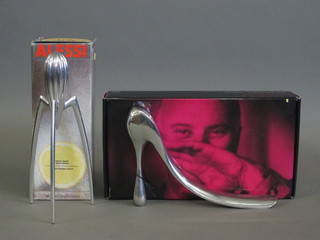 An Alessi lemon squeezer and a Manolo Blahnik shoe horn