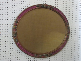 A 1930's oval bevelled plate wall mirror contained in barbola mounted frame 22"