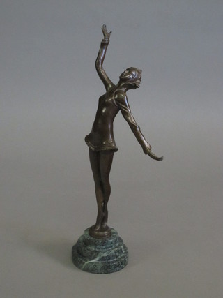 A bronze Art Deco style figure of standing lady with outstretched  arms, raised on a green marble base 13"
