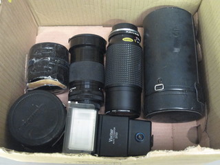 5 camera lenses and a flash unit