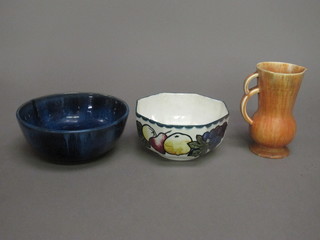 A Denby blue glazed circular bowl 9", an octagonal bowl decorated fruit 7" and an Art Deco brown jug 7"