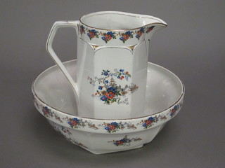 A floral patterned jug and bowl set, bowl cracked,