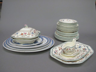 A 35 piece Spode Jasmine Pattern dinner service comprising 2  lozenge shaped meat plates 14" and 12", sauce boat and stand -  stand chipped, 2 tureens and 1 cover - 1 base cracked, 8 dinner  plates 10", 7 side plates 9" - 1 cracked, 7 tea plates 7 1/2" - 1  cracked and 1 chipped, 8 bowls 9" and 4 graduated Willow  pattern plates - all cracked