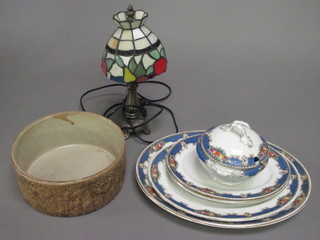 A part dinner service with green banding and decorated fruit, a Liberty style table lamp and 3 circular pottery bowls